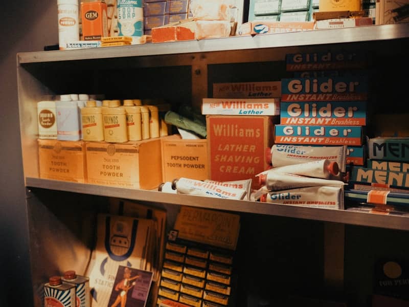 Shelves are stocked with vintage shaving and grooming products.