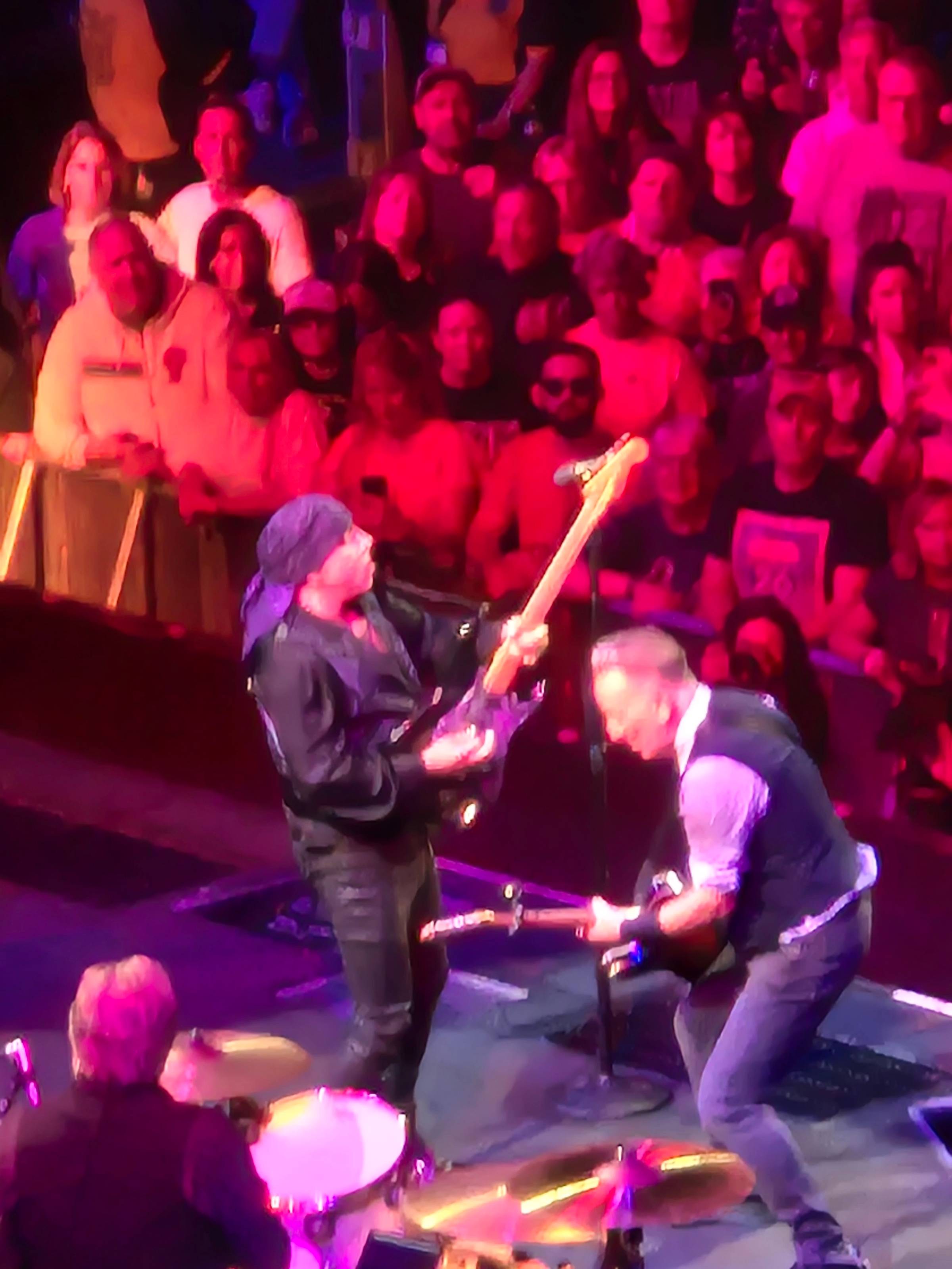 Little Steven Van Zandt and Bruce Springsteen playing guitar on stage