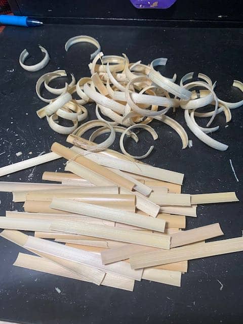 A pile of gouged cane and shavings from the gouging process