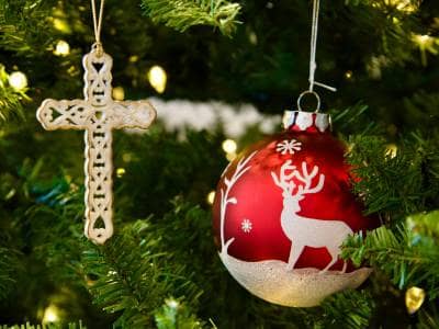 two ornaments hanging on a christmas tree