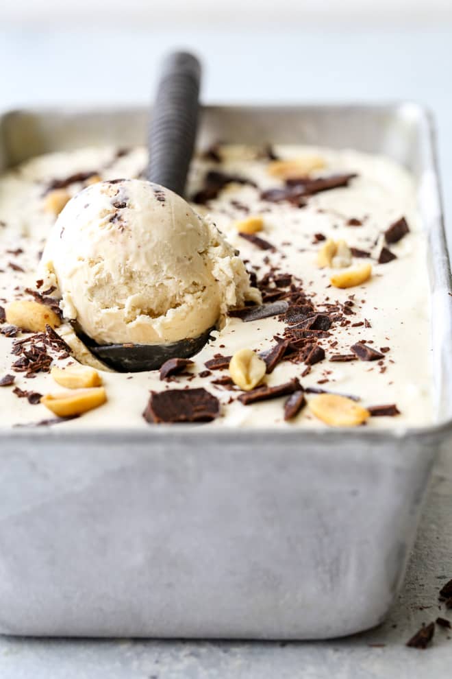 making a scoop of peanut butter chocolate chunk ice cream