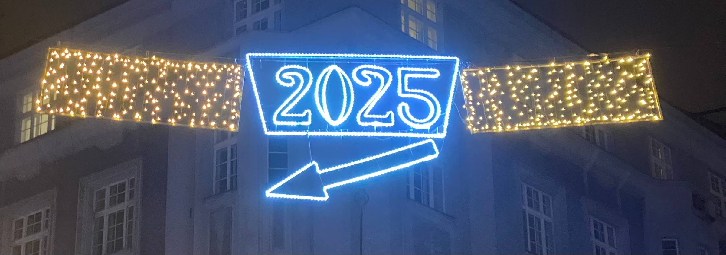 image showing text 2025 with an arrow below the words