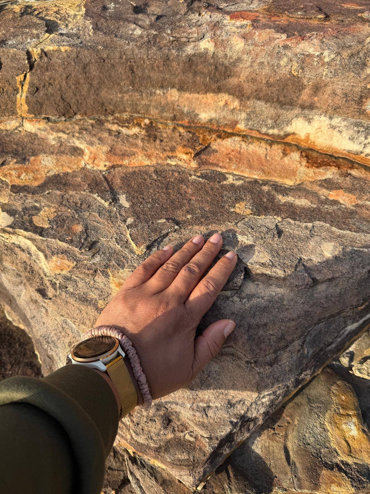 hand on rock at Sandanbeki cliffs