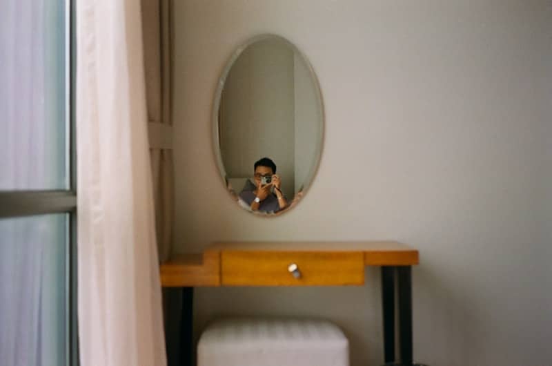 A person taking a picture of themselves in a mirror