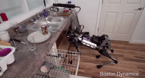 Un robot en train de remplir un lave-vaisselle