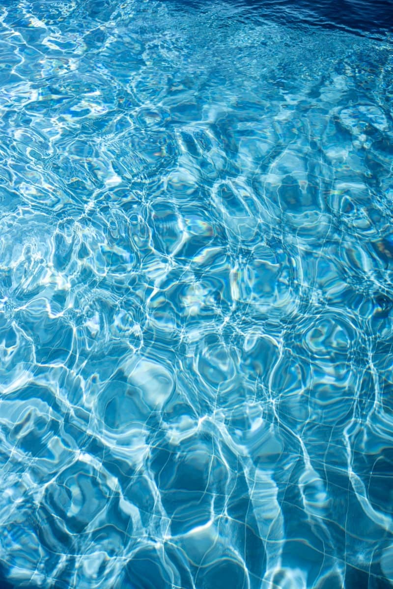 Rippling blue water in a swimming pool