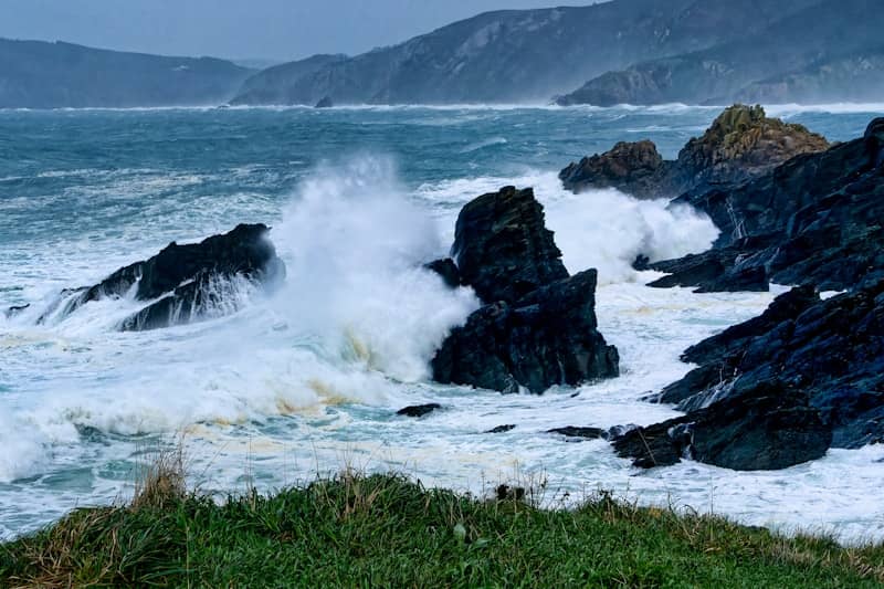 A large body of water surrounded by rocks