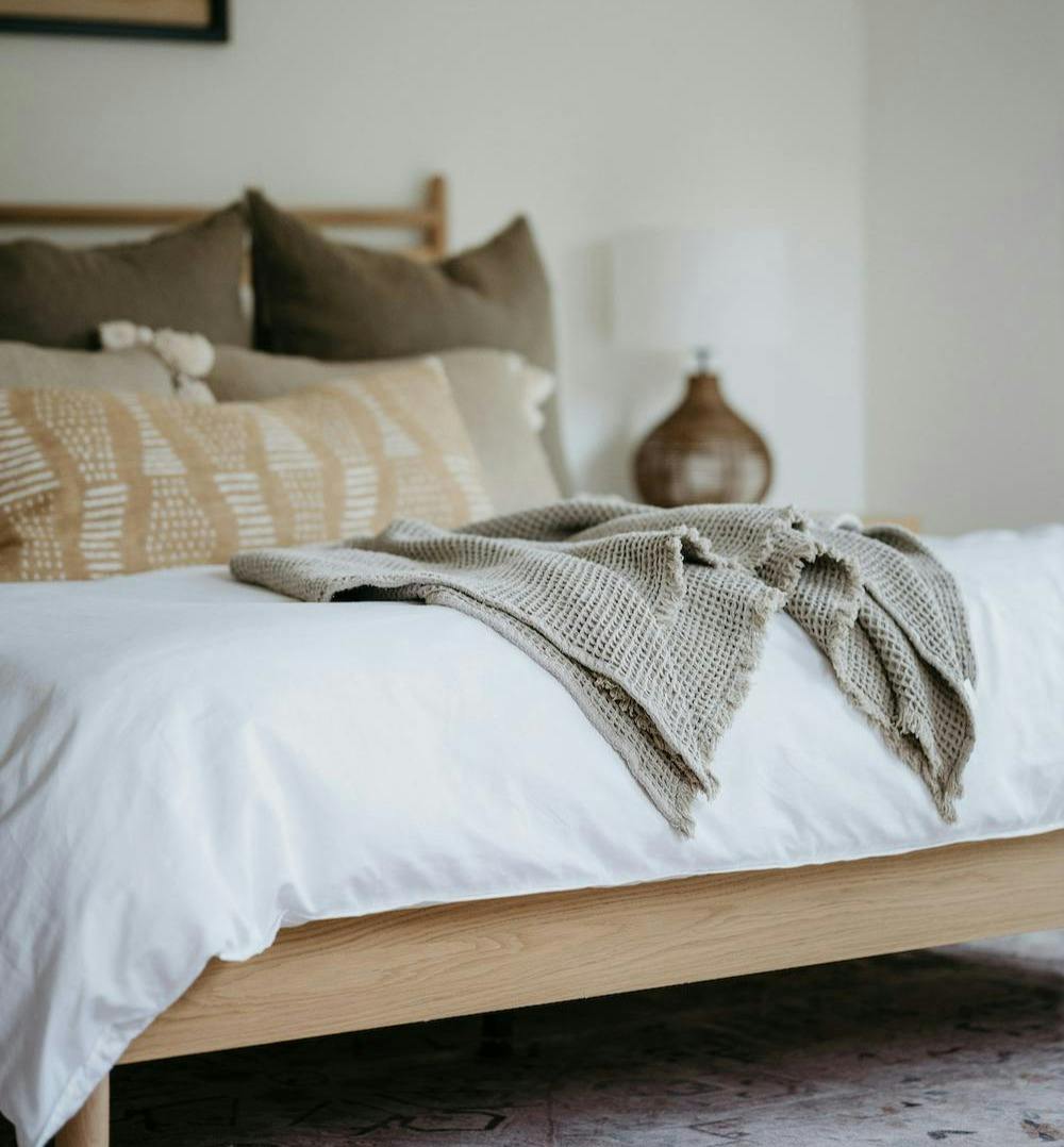 bed with pillows and blanket