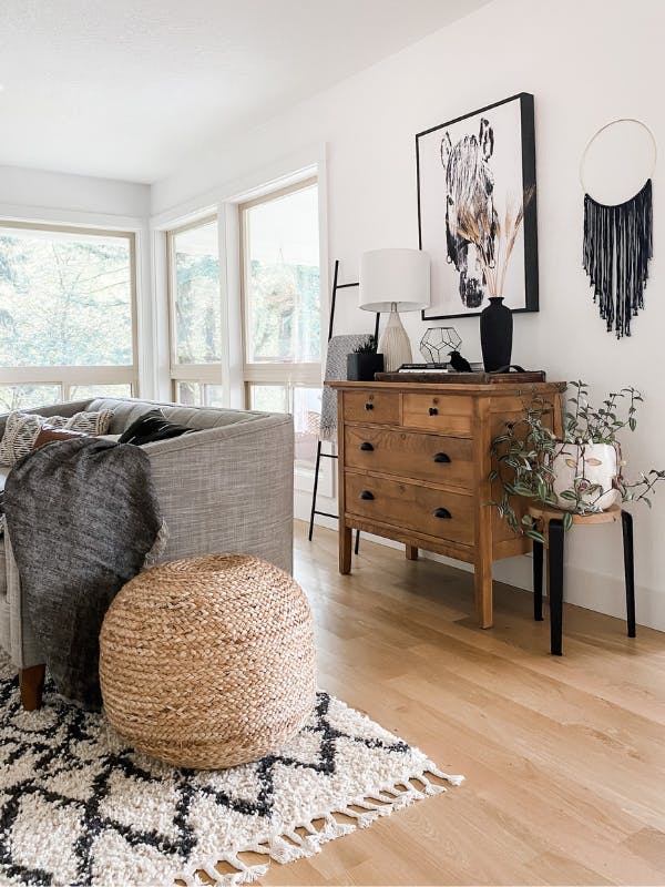 living room with neutral couch and big windows