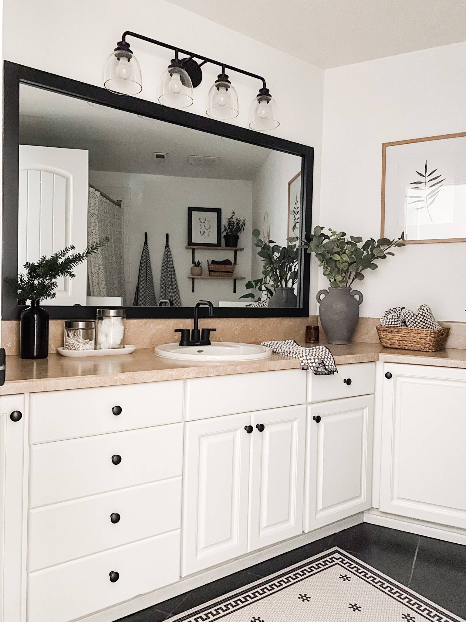 black and white kitchen with wood shelves