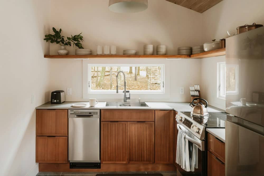 kitchen with wood cabinets and wood shelf 