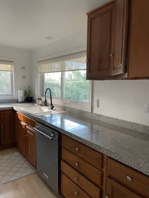 kitchen with oak cabinets and granite tile counter