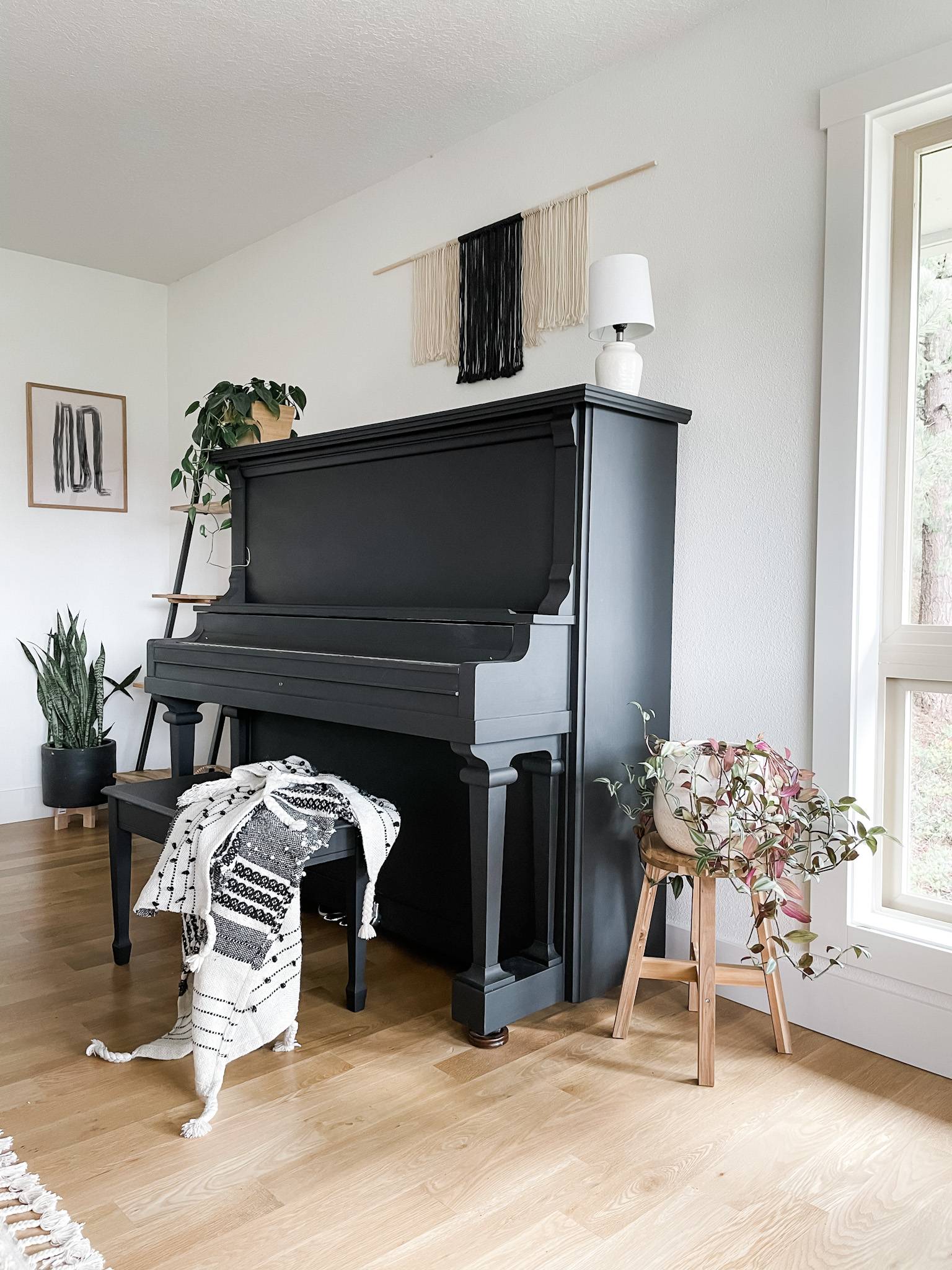 painted black piano in living room