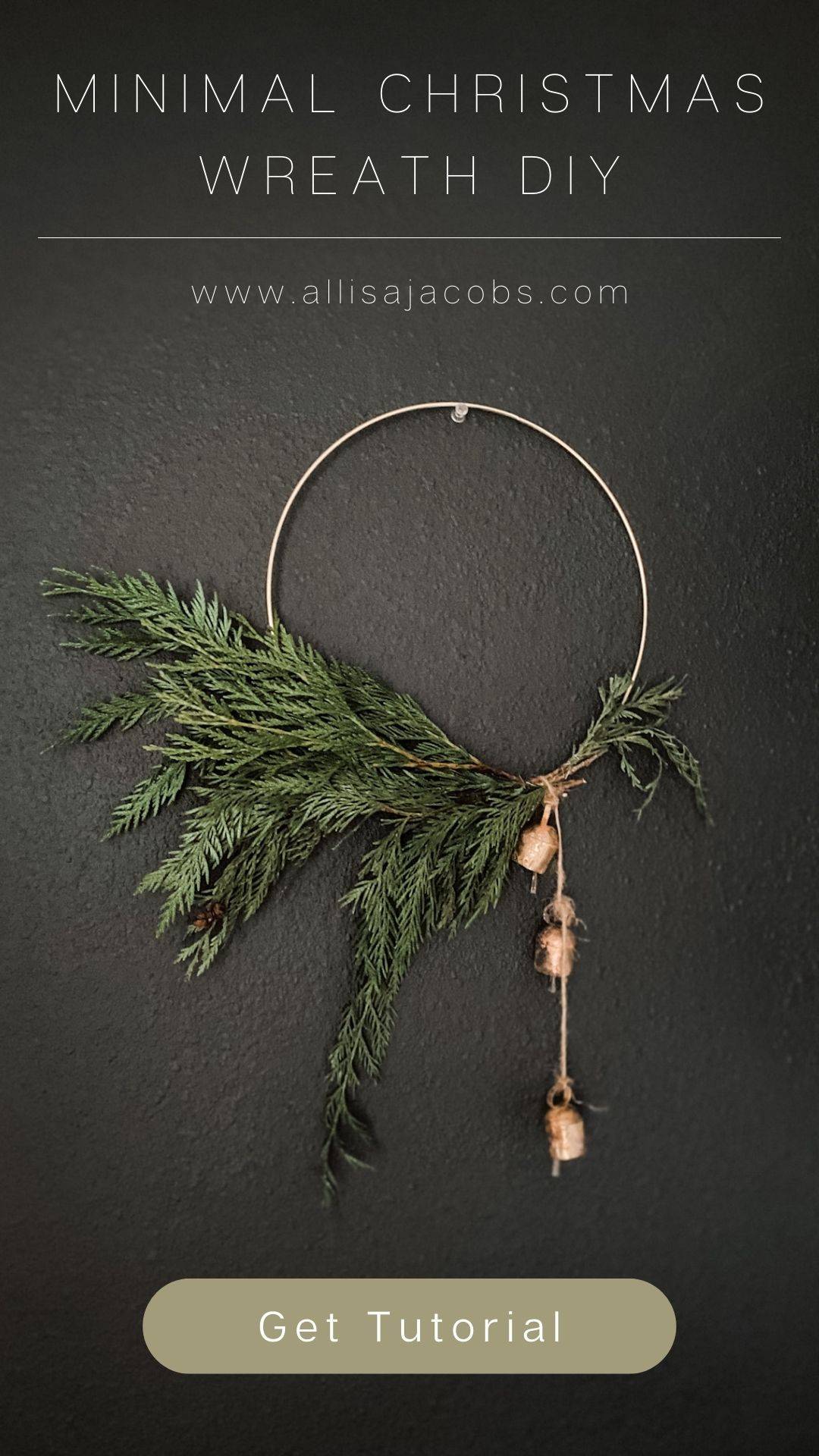 hoop wreath with greenery on black wall