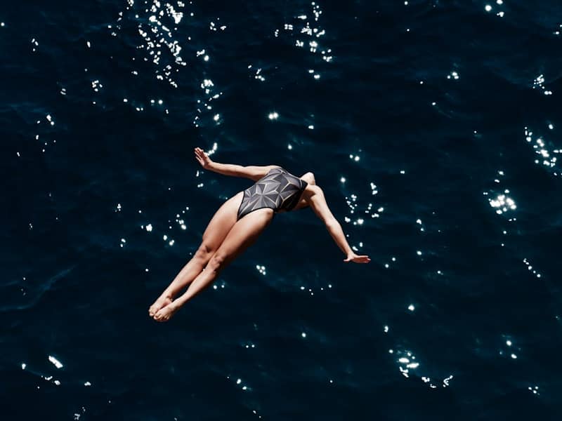 A woman floating in the ocean on her back