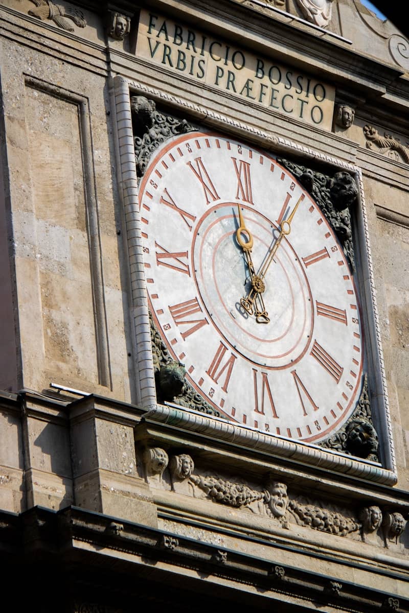 An ornate clock tower shows roman numerals.