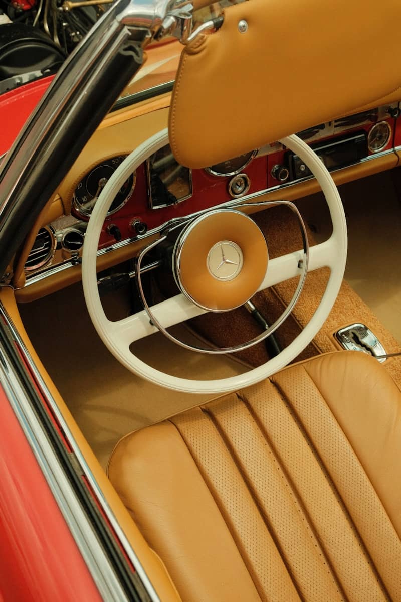 Inside of a classic car with tan leather.