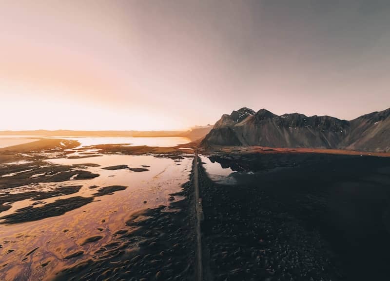Roadside view of mountains and sunset colors.