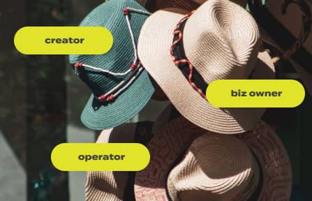 Stack of hats labeled: creator, biz owner, operator.
