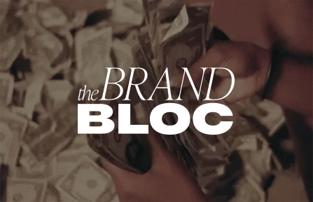 Counting money with The Brand Bloc logo.
