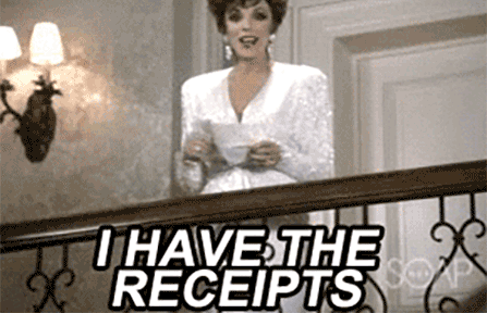 Woman showing the receipts over staircase balcony.