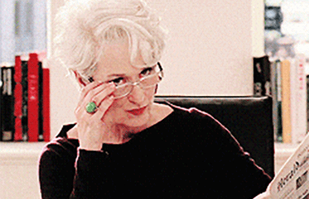 Fashion editor taking off glasses