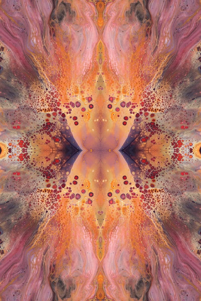an abstract image of an orange and pink flower