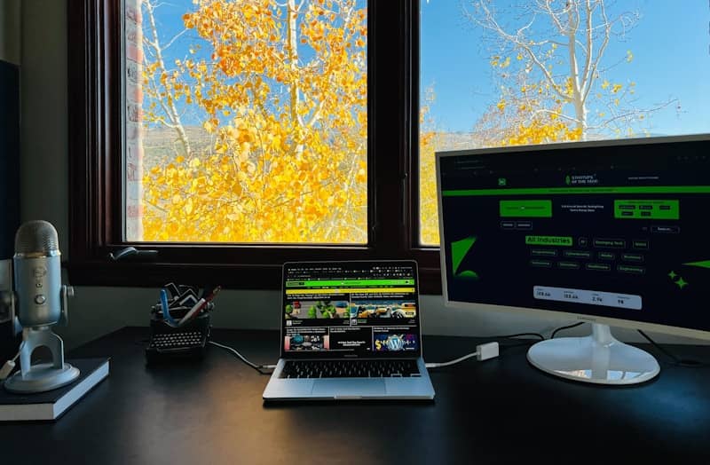 A laptop computer sitting on top of a desk