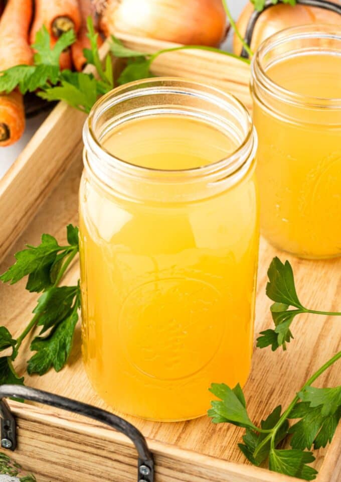 Jars with chicken stock in them