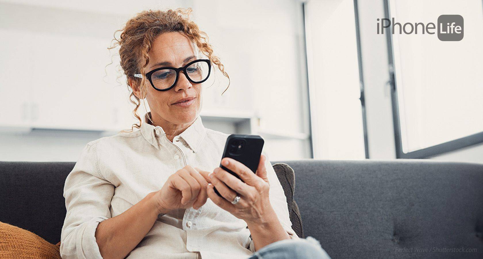 Woman looking at iPhone