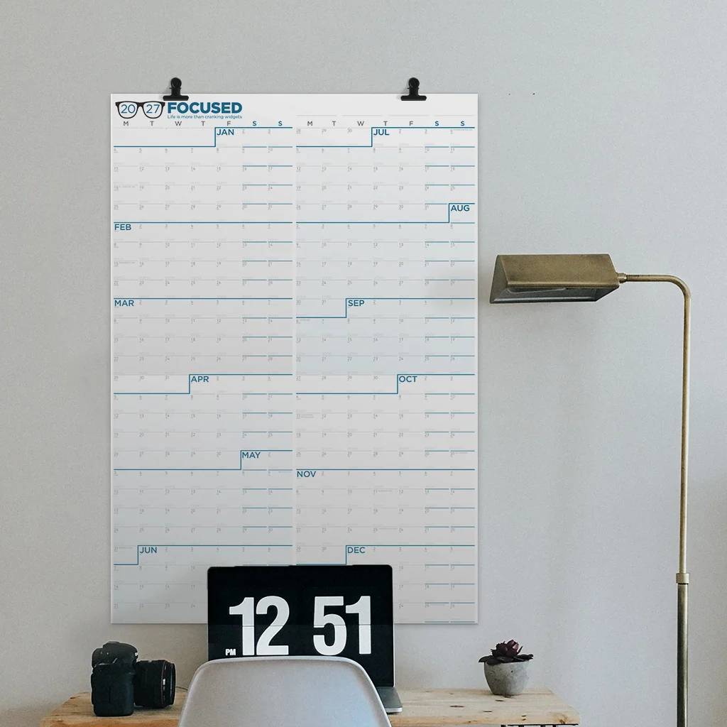 The 2027 Focused Calendar hanging above a desk
