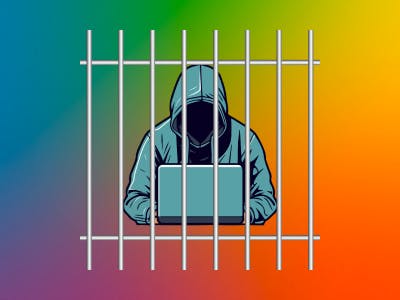 An image of a hacker behind bars