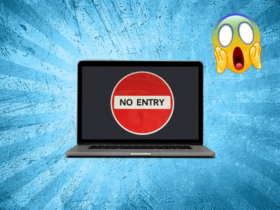 A laptop with a "No Entry" sign on the screen and a panic emoji