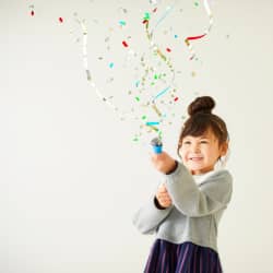 girl celebrating with confetti