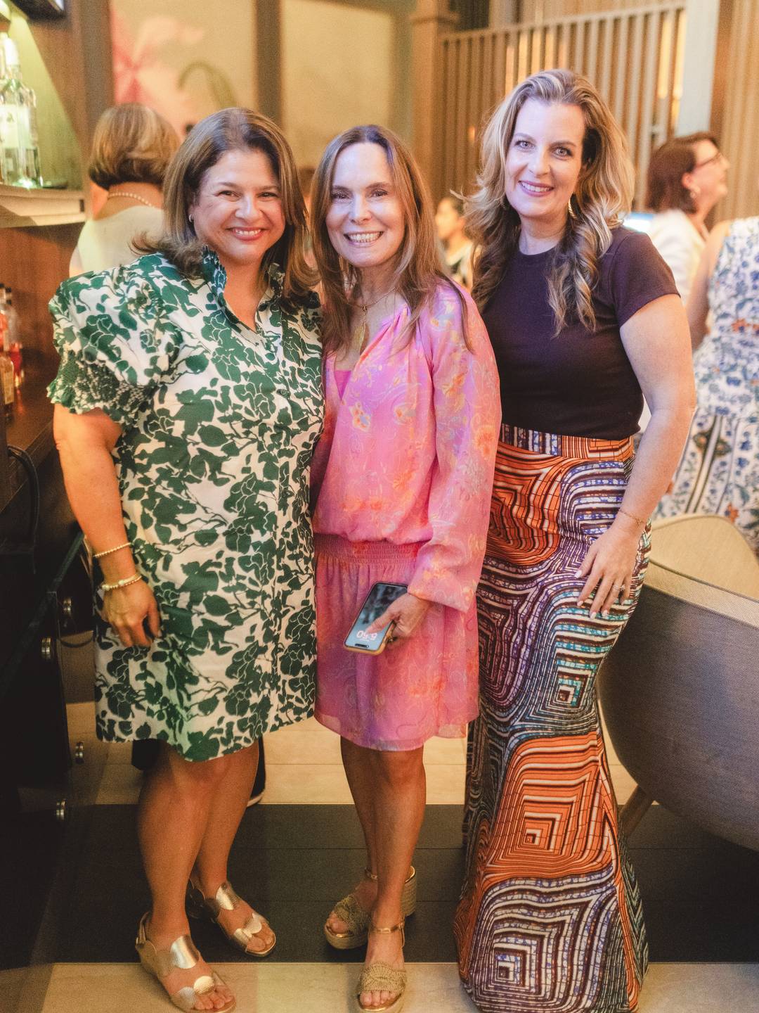 women posing for photos at Cocktails & Connections event featuring 305 Hive Media, Fem City & Luly B 