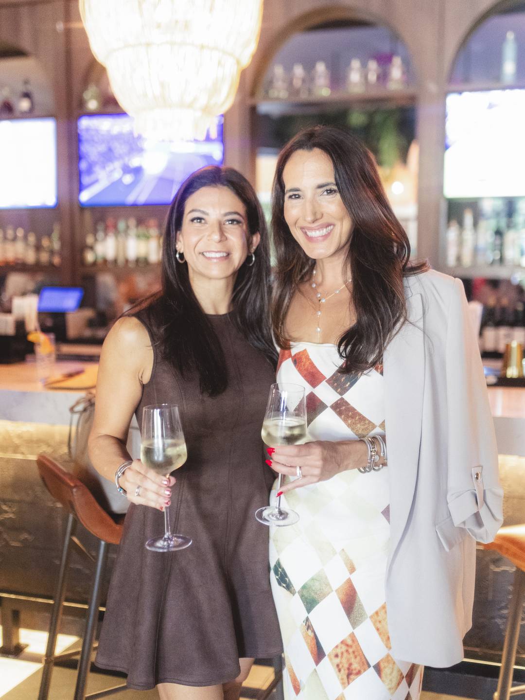 women posing for photos at Cocktails & Connections event featuring 305 Hive Media, Fem City & Luly B 