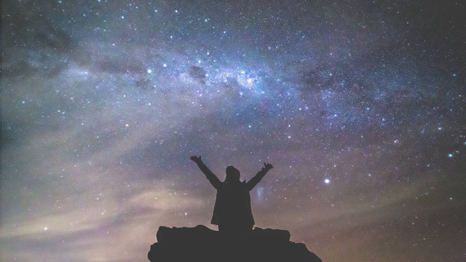 person looking to the stars with hope
