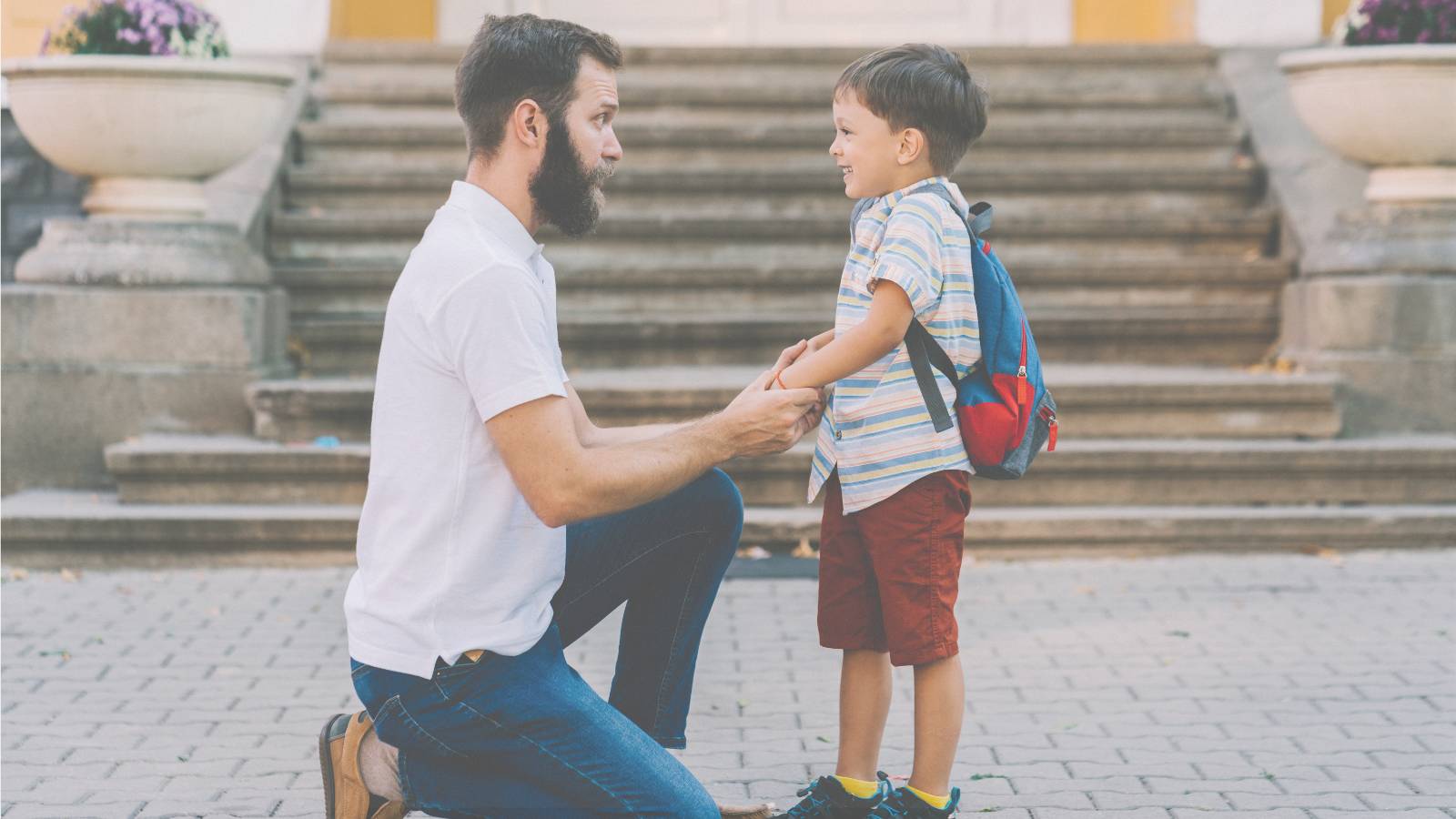 Father kneeling down to a child