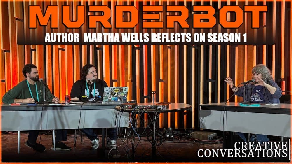 Picture of the interview: James and Luke are interviewing Martha, image reads Murderbot Author Martha Wells reflects on Season 1