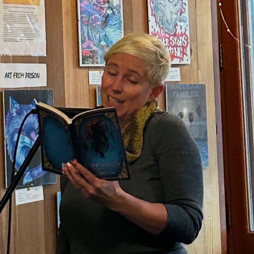 Jessie reads from Outsiders at a fundraising event