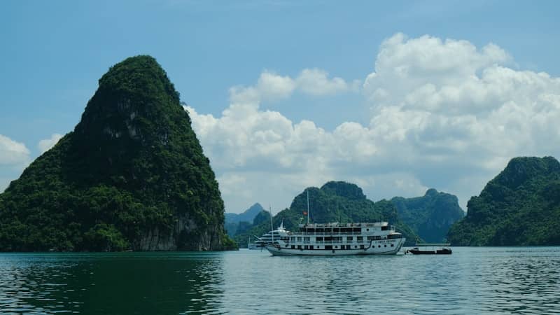 A large boat floating on top of a large body of water