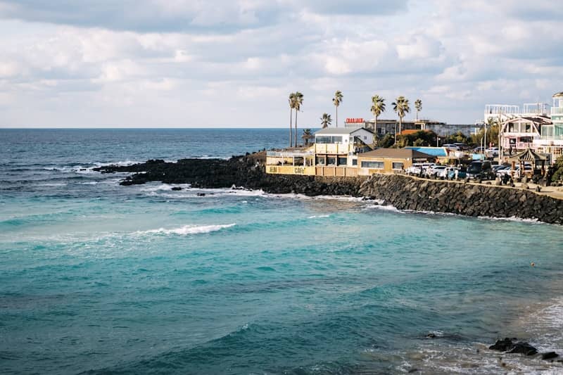 A body of water next to a rocky shore