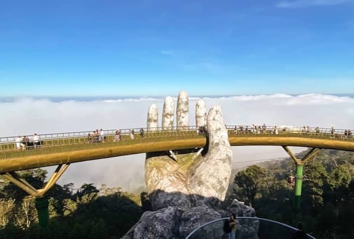 Golden bridge, held by giant hands in vietnam.