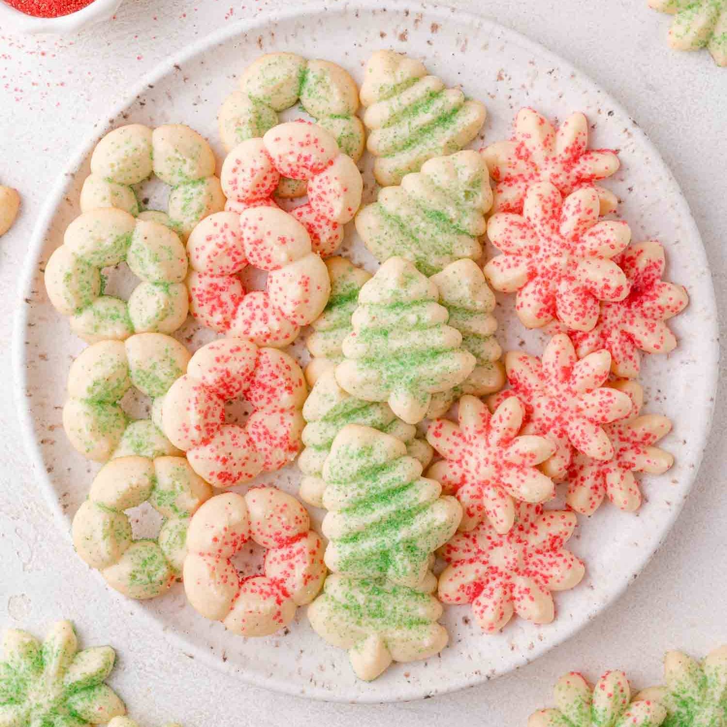 Cream cheese spritz cookies on a plate.