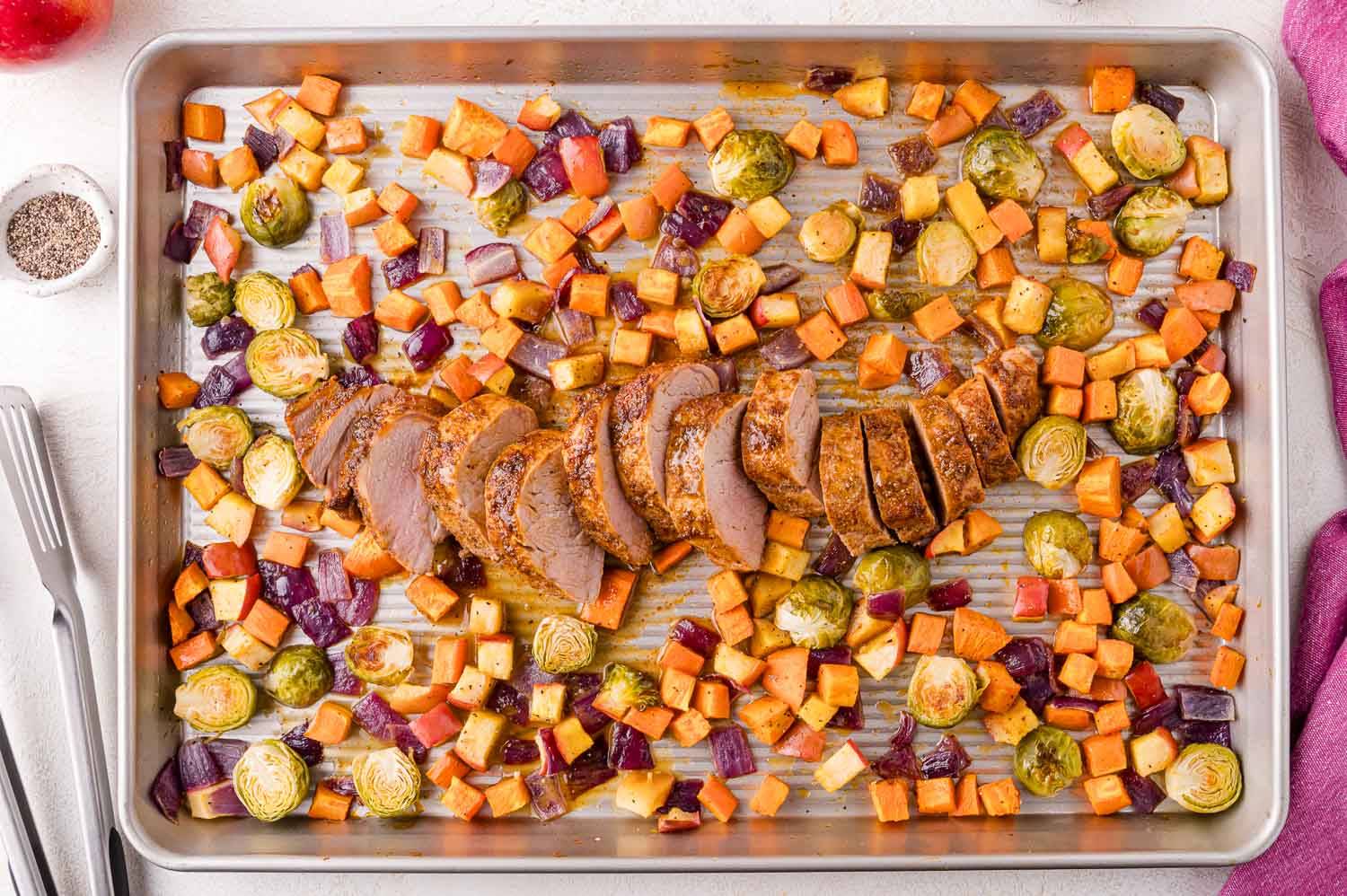 Sheet pan pork tenderloin with apples, sweet potatoes, Brussels sprouts.