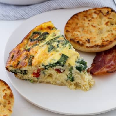 Crustless quiche on a white plate.