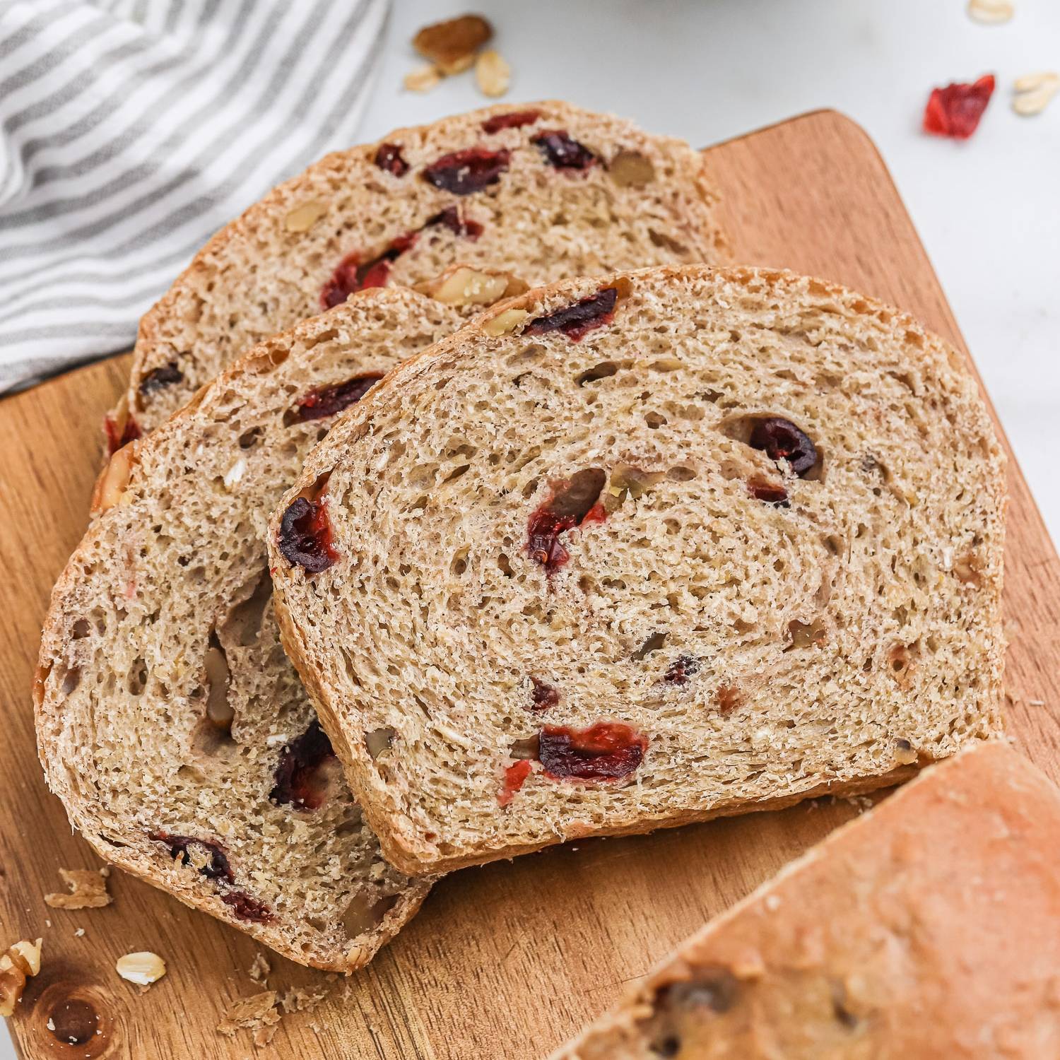Sliced pieces of cranberry walnut oat bread.