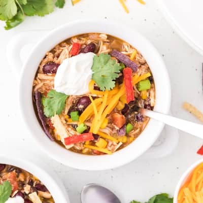 Taco soup in a white crock-style bowl.