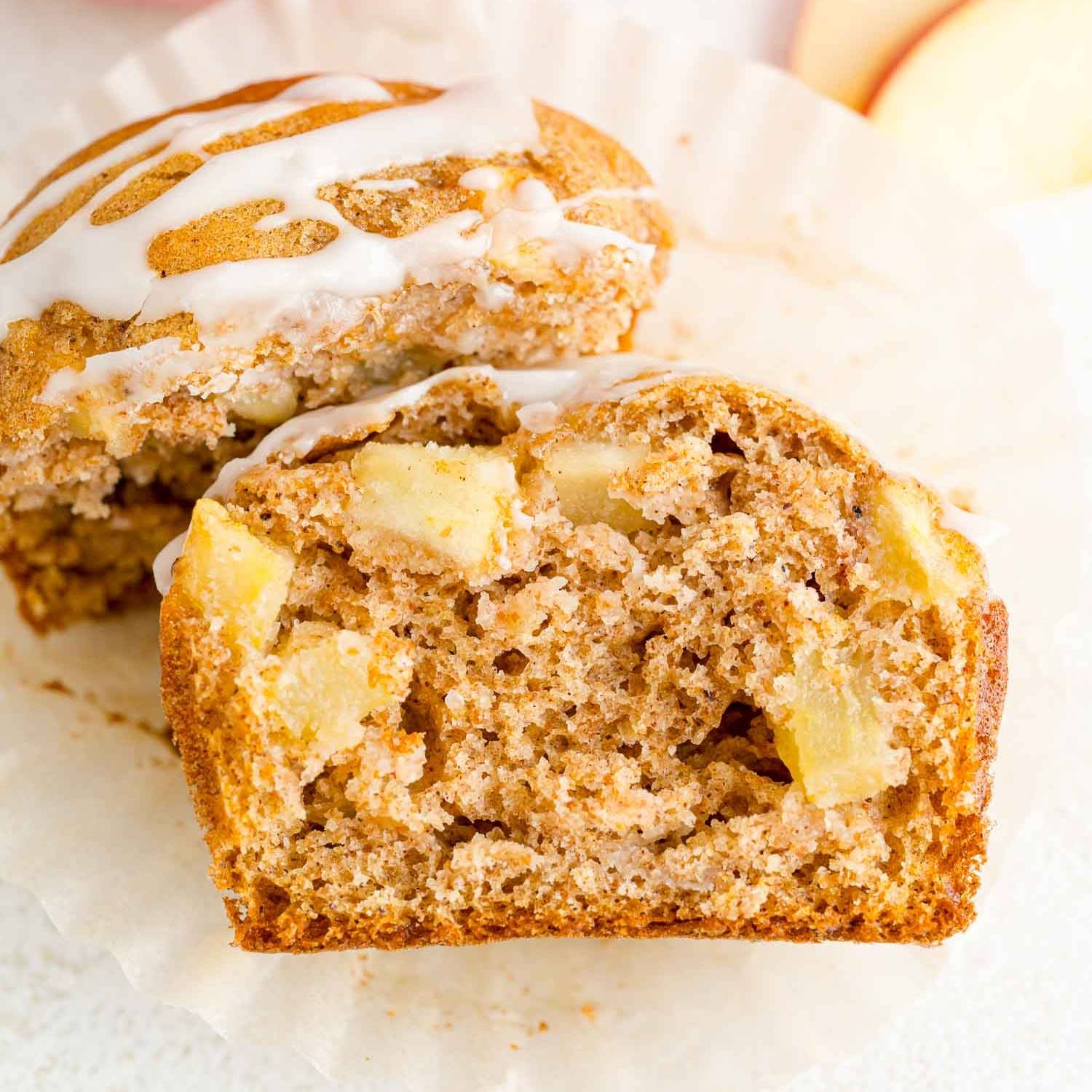 An apple muffin, split open to show inside.