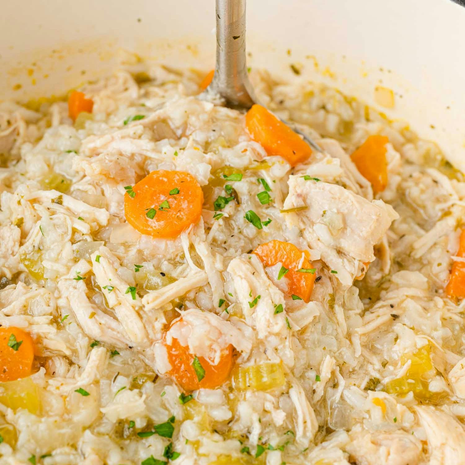 Chicken rice soup in a pot.